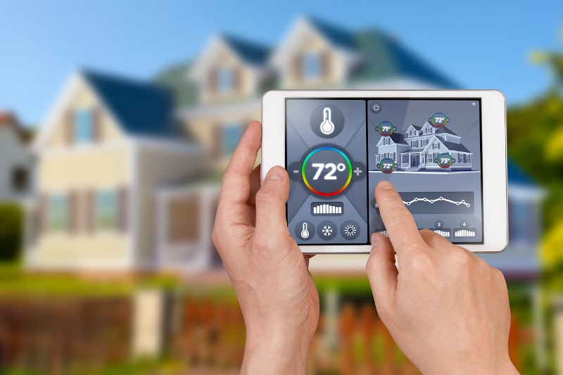 person operating smart thermostat from tablet person operating smart thermostat from tablet