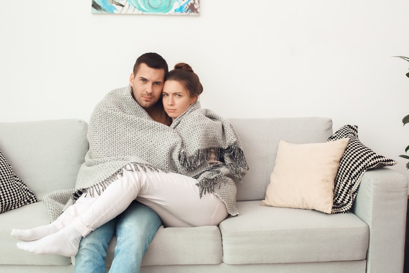 Young Couple Cold In Blanket Young Couple Cold In Blanket